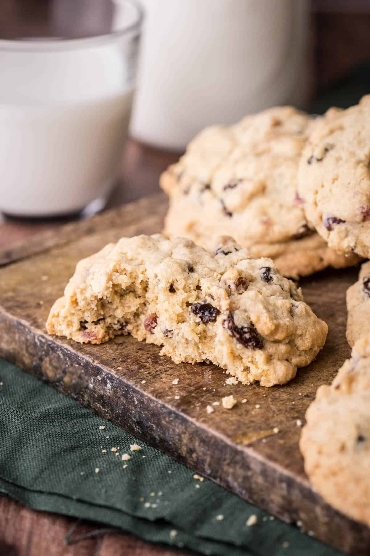 Gluten-Free Rock Cake on a table, halved showing tender crumb stuffed with dried fruits.