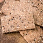 Seeded Gluten-Free Crispbreads on wooden board.