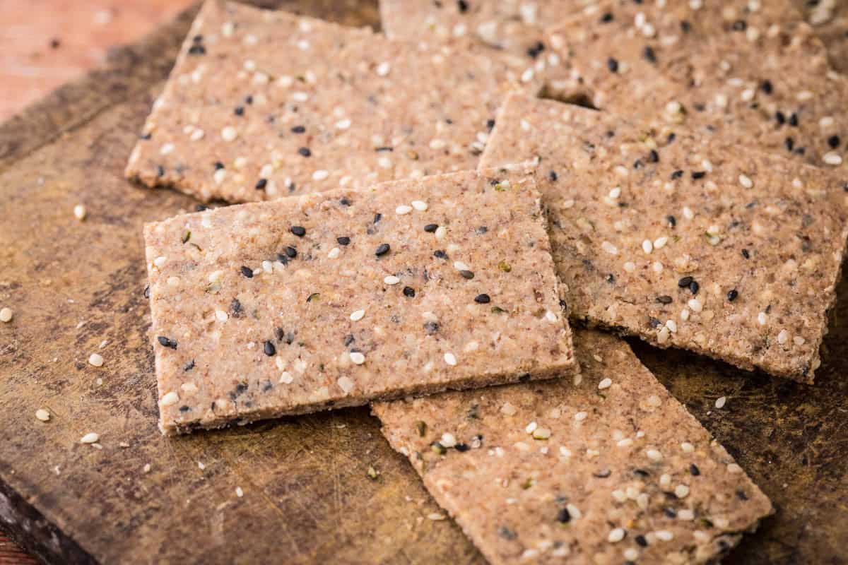Seeded Gluten-Free Crispbreads on wooden board.