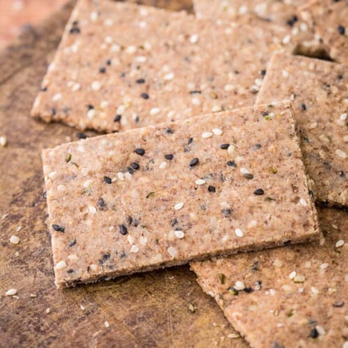 Seeded Gluten-Free Crispbreads on wooden board.