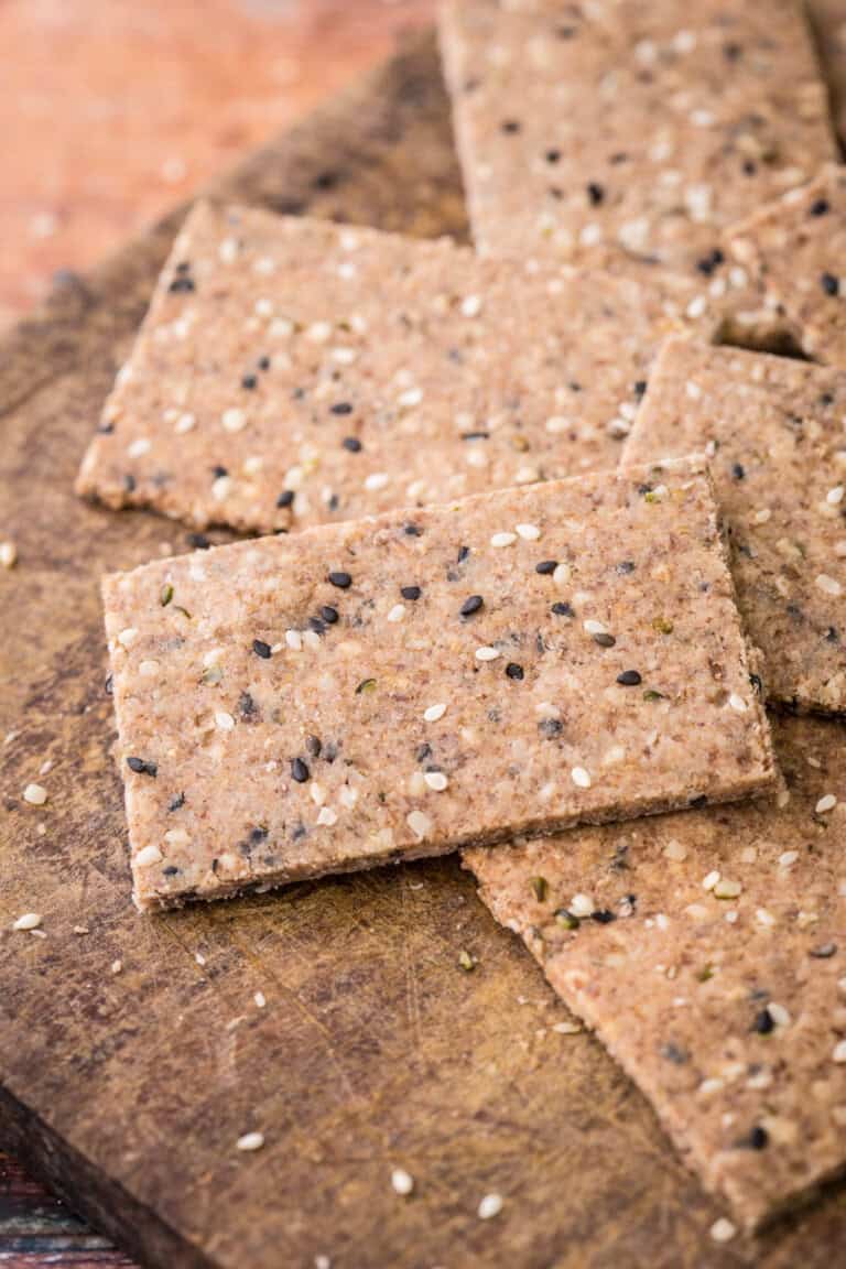 Seeded Gluten-Free Crispbreads on wooden board.