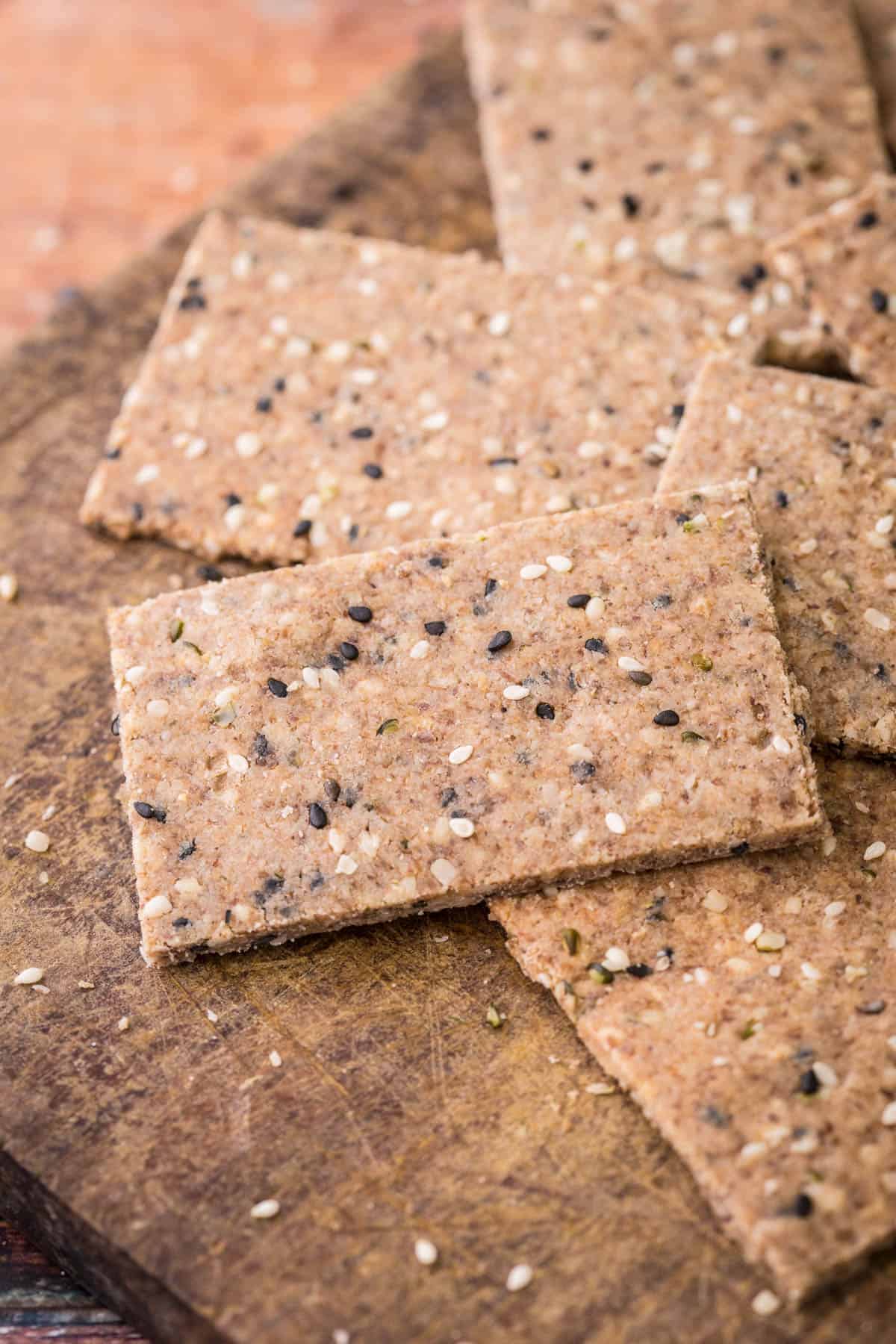 Seeded Gluten-Free Crispbreads on wooden board.