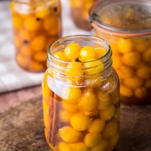 Pickled mirabelles packed into a sterilised jar.