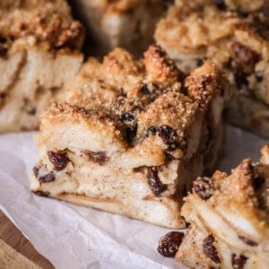 Sliced bread pudding showing creamy soft pudding with crunchy sugar topping.