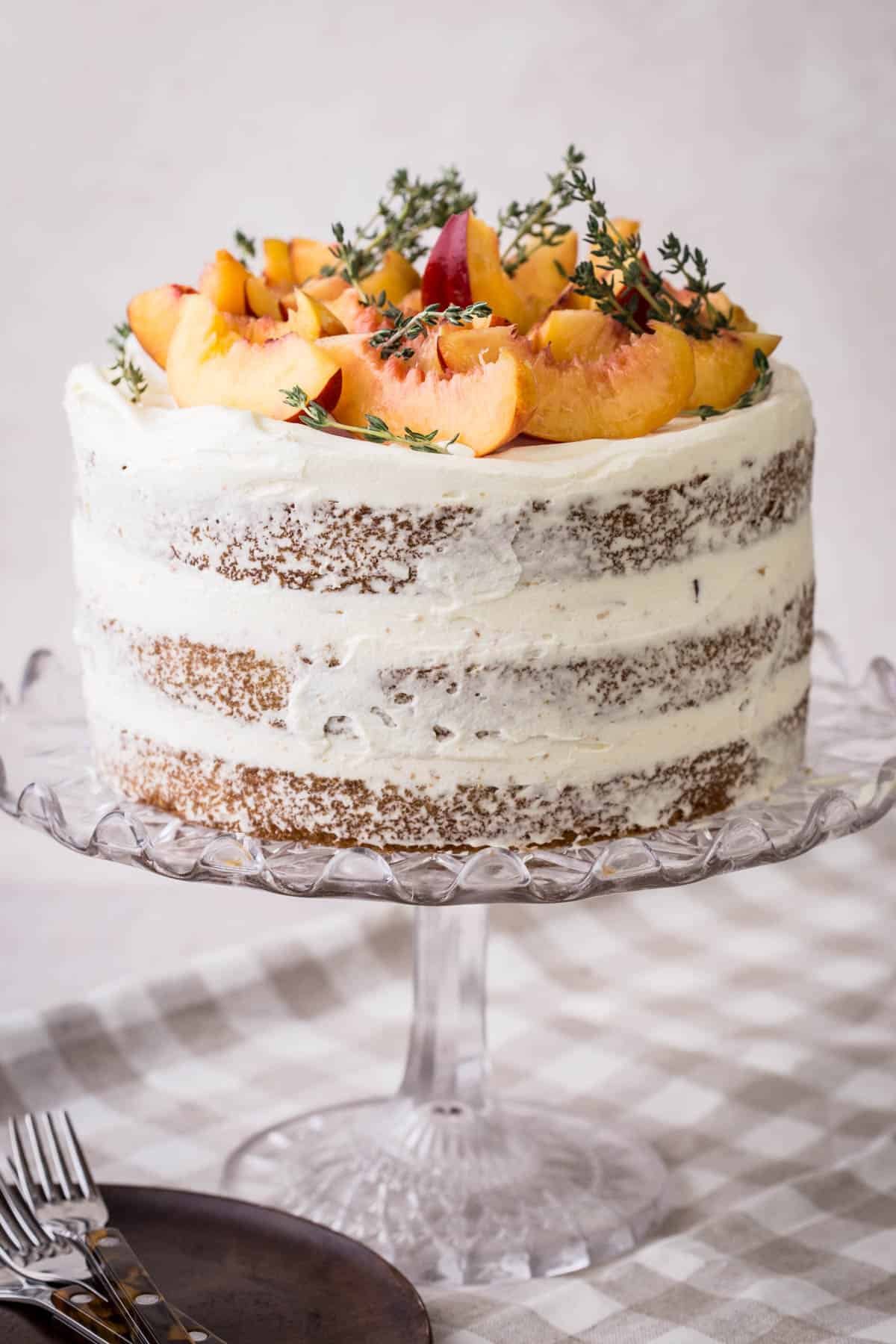 Nectarine Thyme Limoncello Cake on a cake stand.