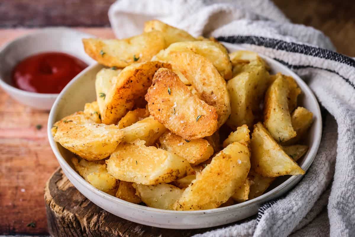 Everyday Seasoning Blend Oven Baked Potato Wedges in a bowl.
