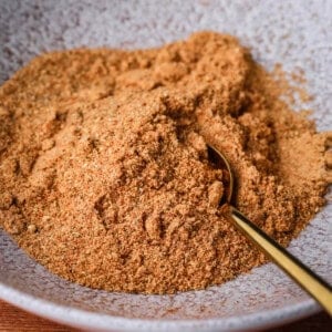 Ground Everyday Seasoning Blend in a bowl with a spoon.