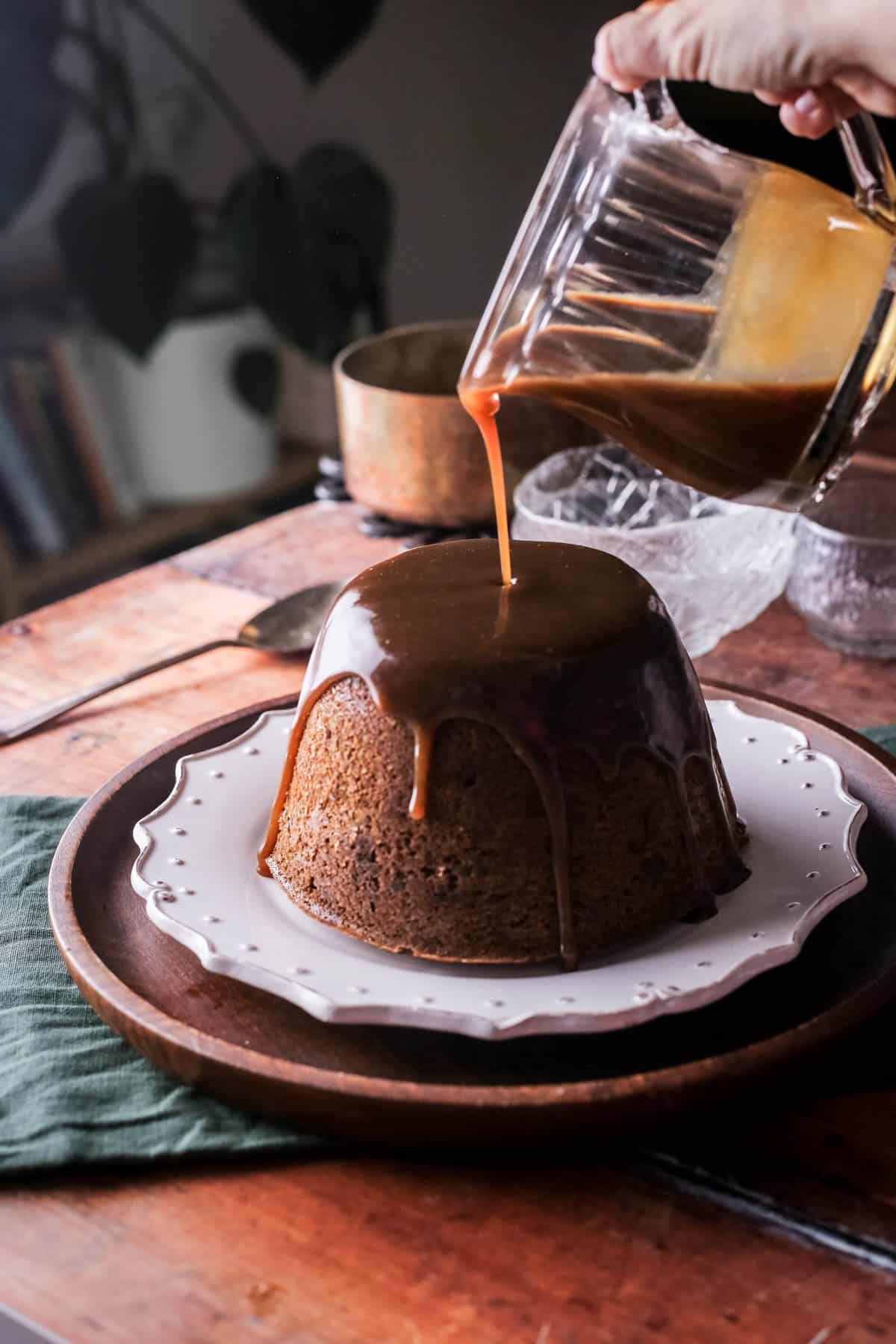 Christmas Pudding with Sticky Toffee Sauce poured generously over so it's thick and luscious.