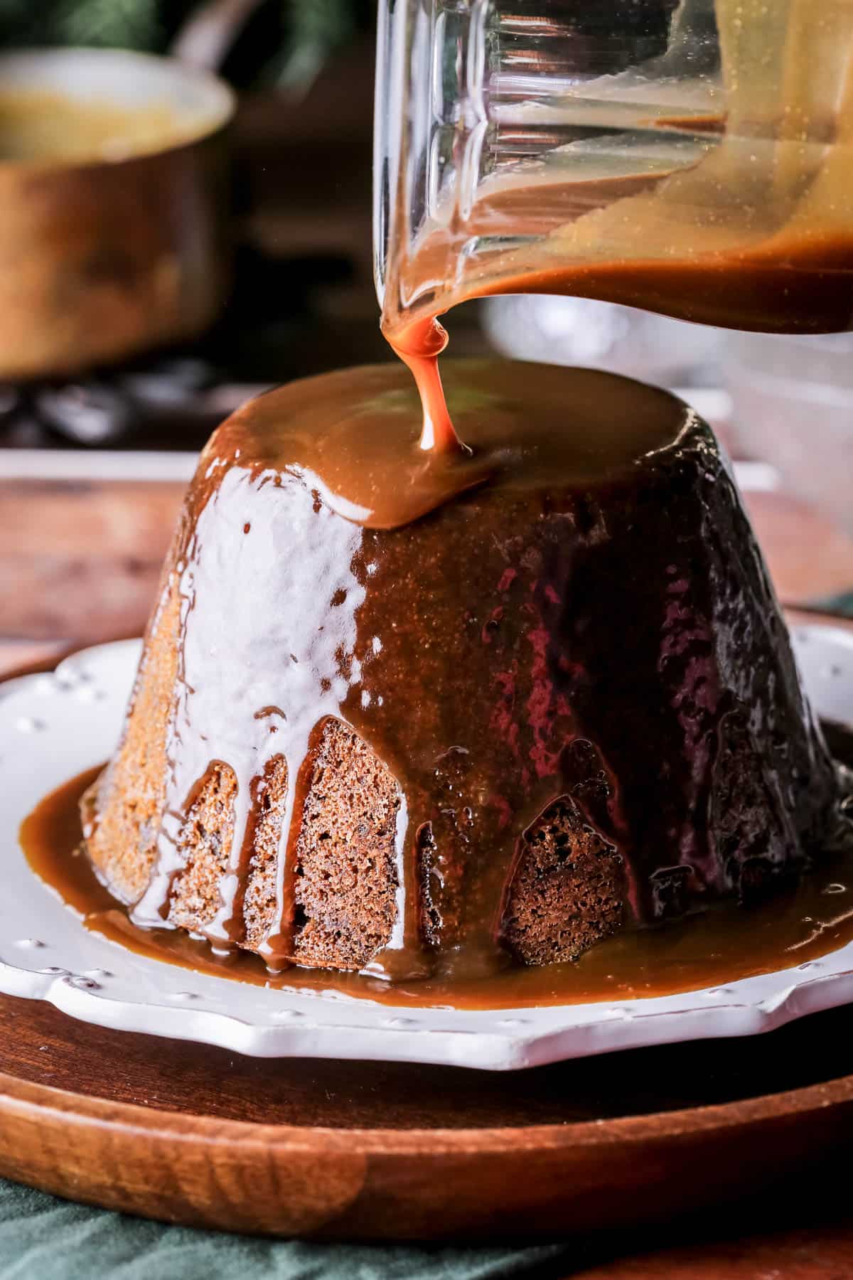 Christmas Pudding with Sticky Toffee Sauce poured generously over so it's thick and luscious.