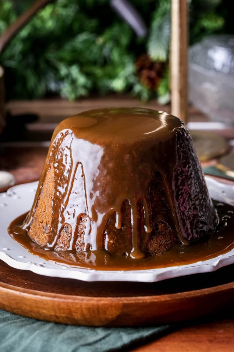 Christmas Pudding with Sticky Toffee Sauce poured generously over so it's thick and luscious.