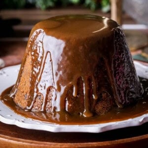 Christmas Pudding with Sticky Toffee Sauce poured generously over so it's thick and luscious.