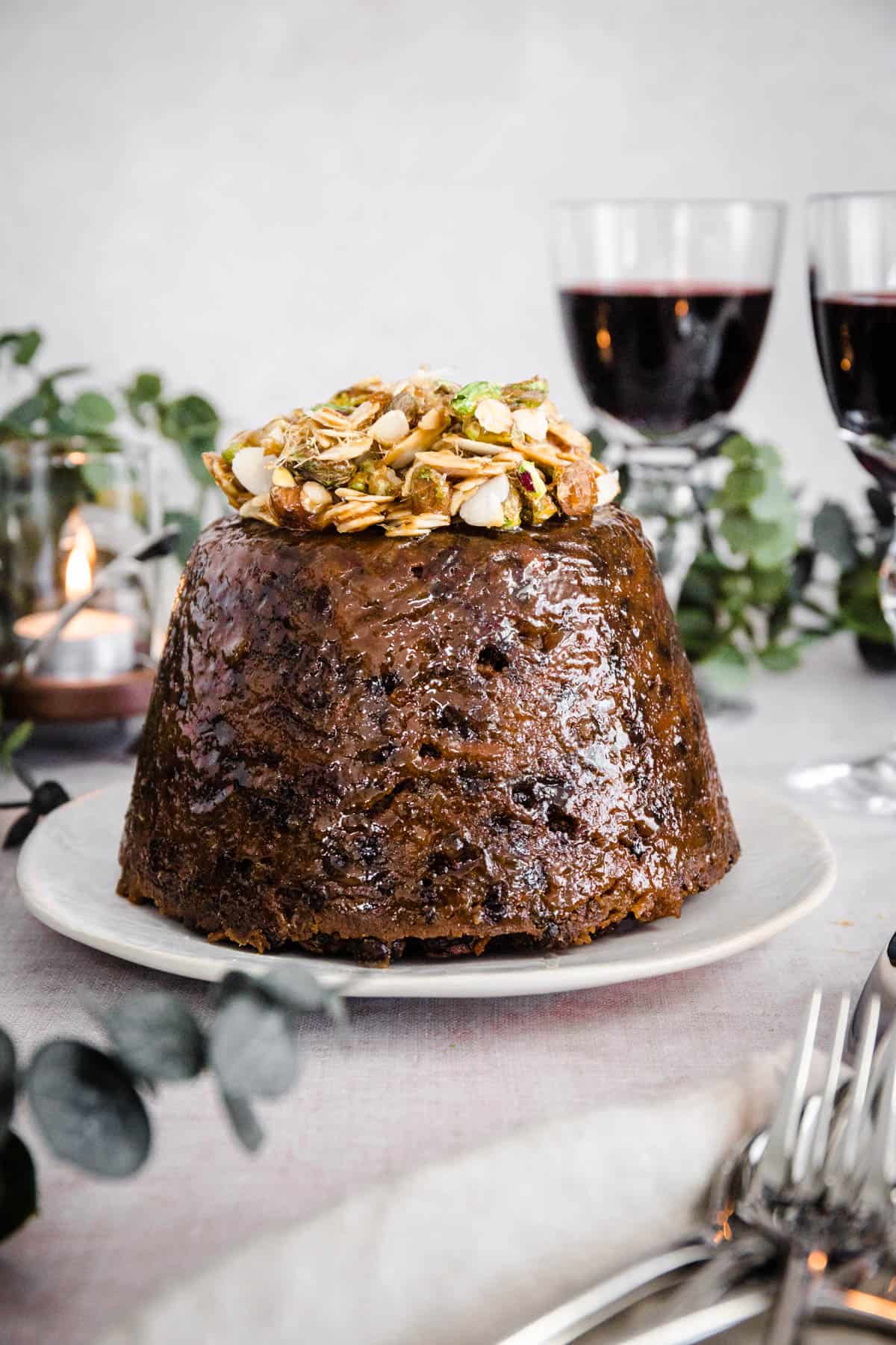 Christmas Pudding decorated with caramelised nuts.