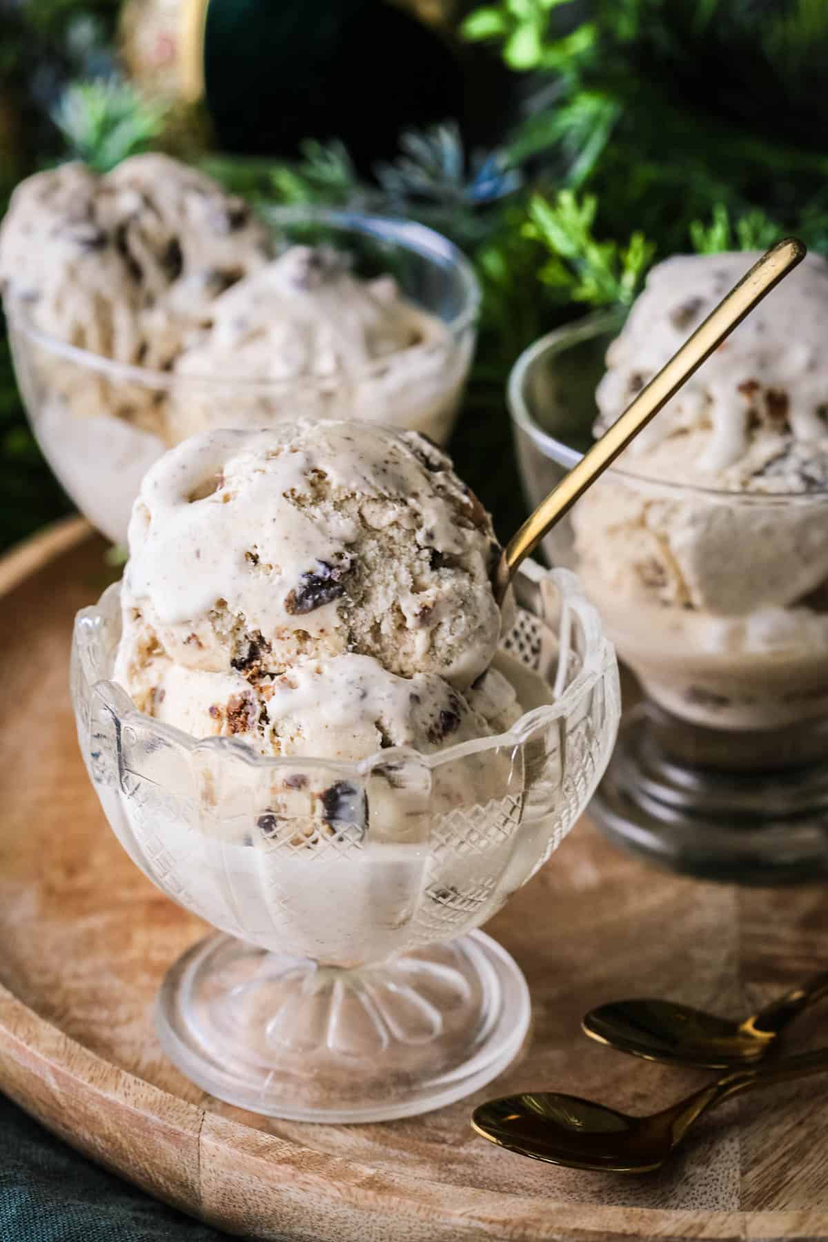 Christmas Pudding Ice Cream in an ice cream bowl, lusciously creamy with christmas pudding studded throughout.
