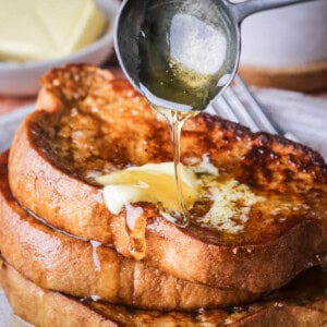 Gluten-Free French Toast with melted butter and honey poured over the top.