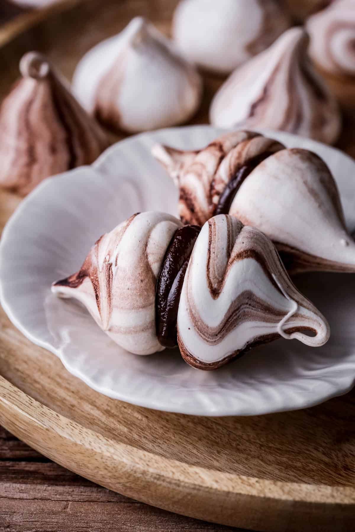 Cocoa Meringue Kisses with chocolate ganache sandwiched inside.