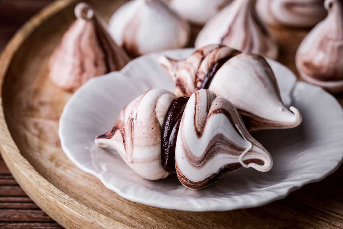 Cocoa Meringue Kisses with chocolate ganache sandwiched inside.