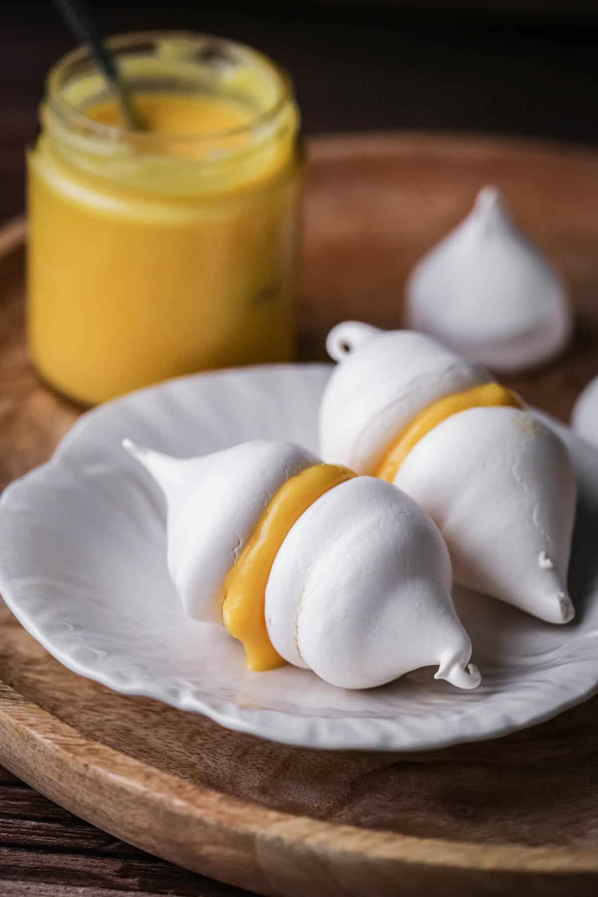 Meringue Kisses with orange curd sandwiched inside.