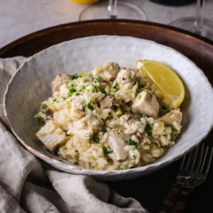 A bowl of silky Turkey Risotto showing creamy texture with juicy turkey.