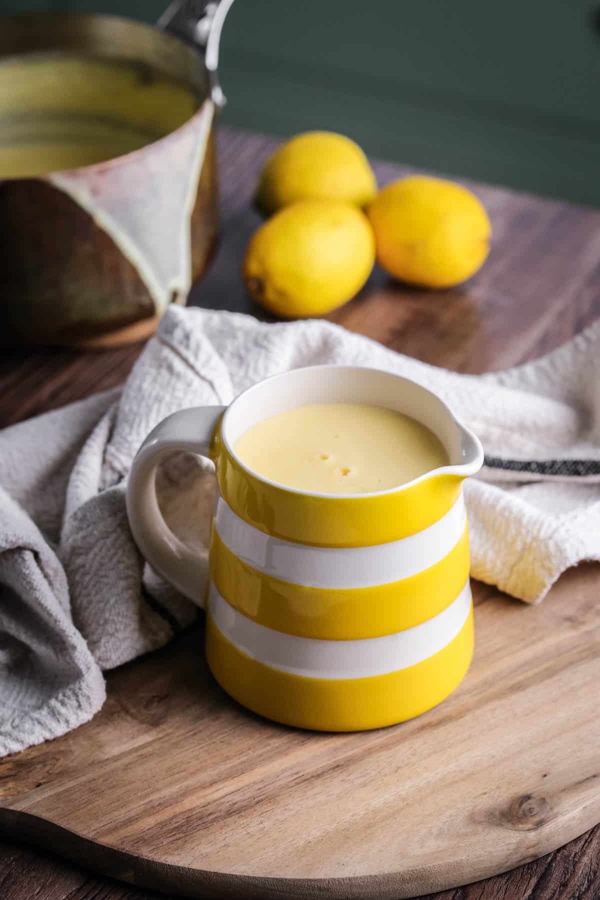 Lemon custard sauce in a jug.