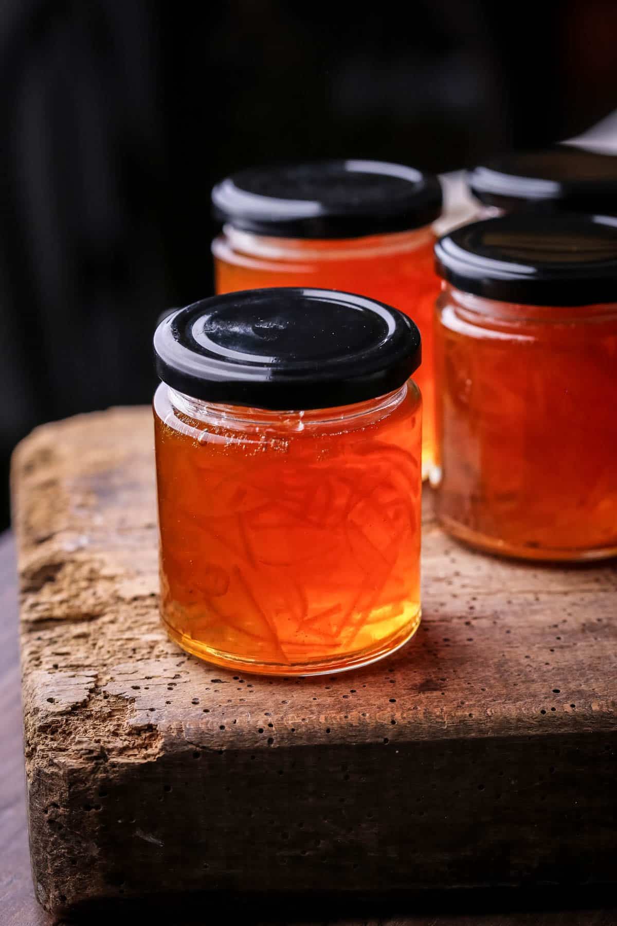 Jar of marmalade showing clear set and peel suspended throughout.