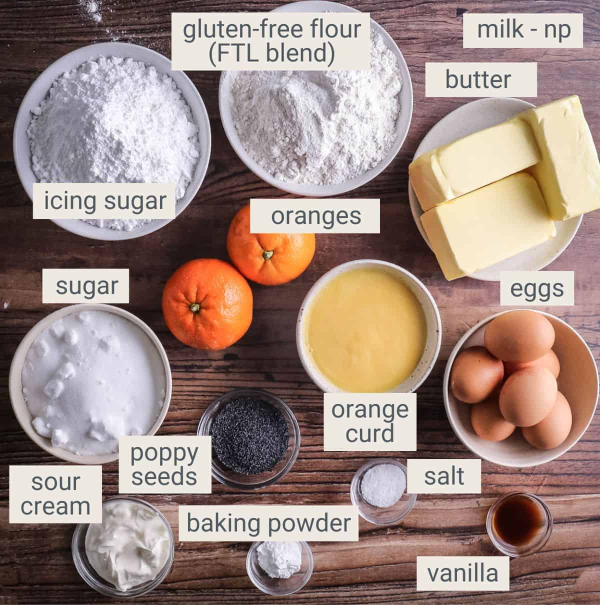 Gluten-Free Orange & Poppy Seed Cake ingredients on a table.