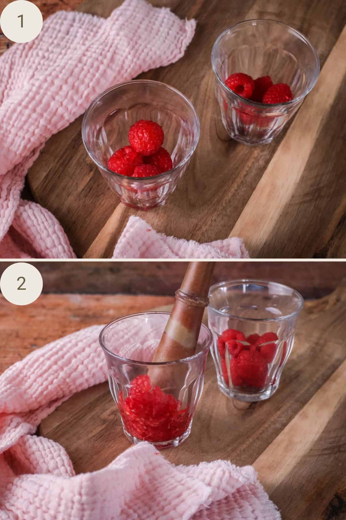 Raspberries placed in bottom of small glasses and muddled with a pestle.