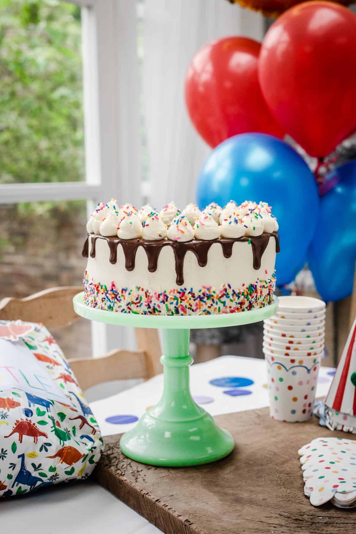 Birthday Cake showing thick chocolate drip.