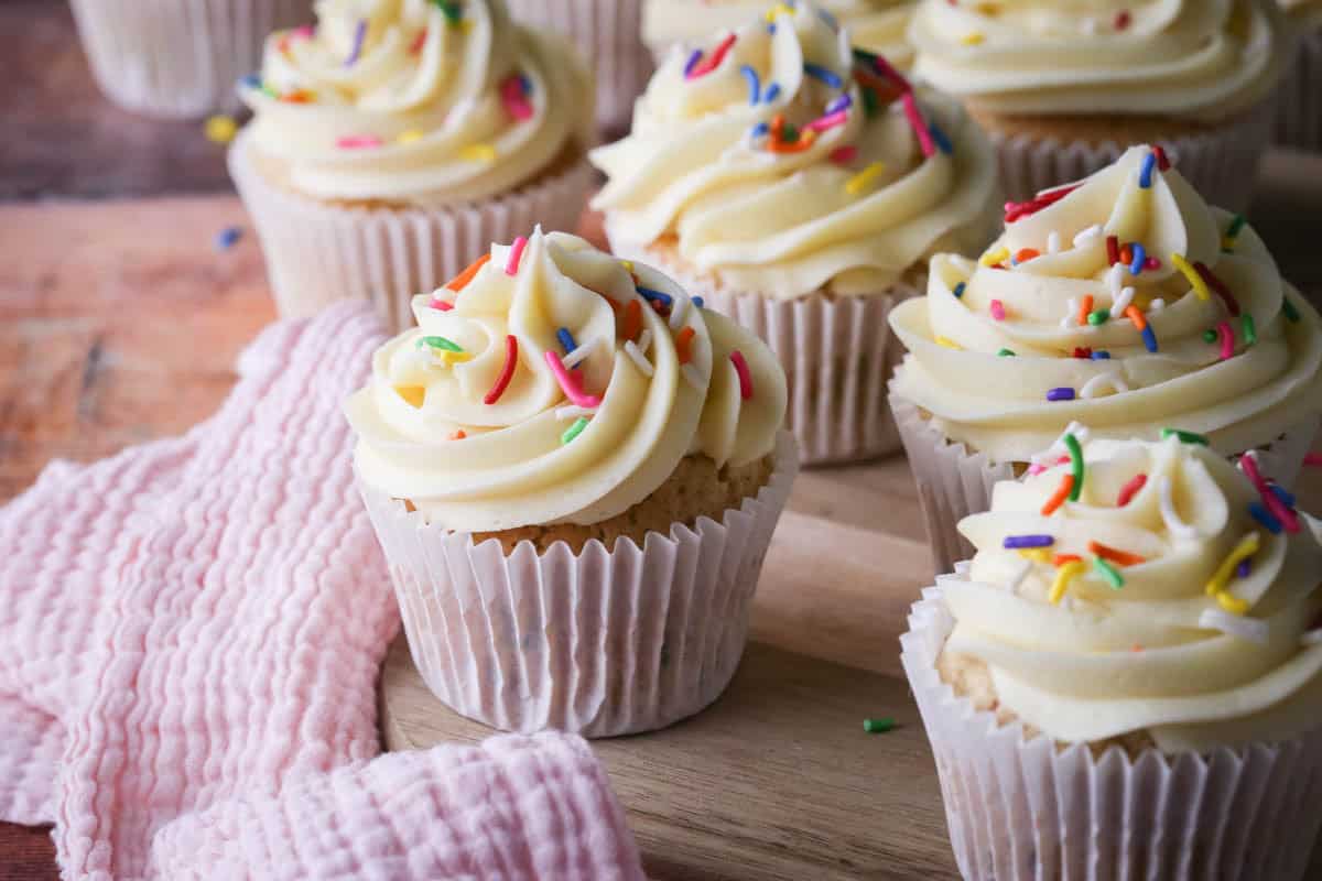 Gluten-Free Funfetti Cupcakes on a board.