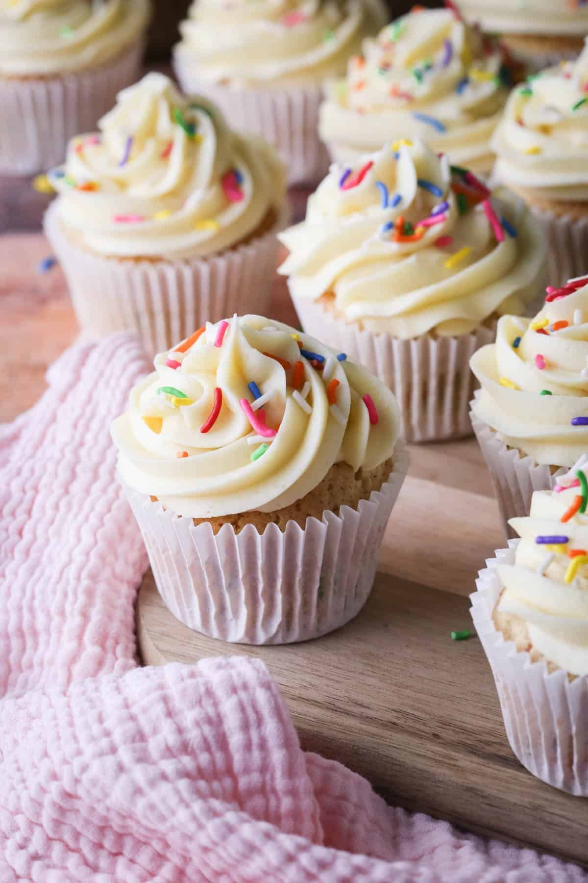 Gluten-Free Funfetti Cupcakes on a board.