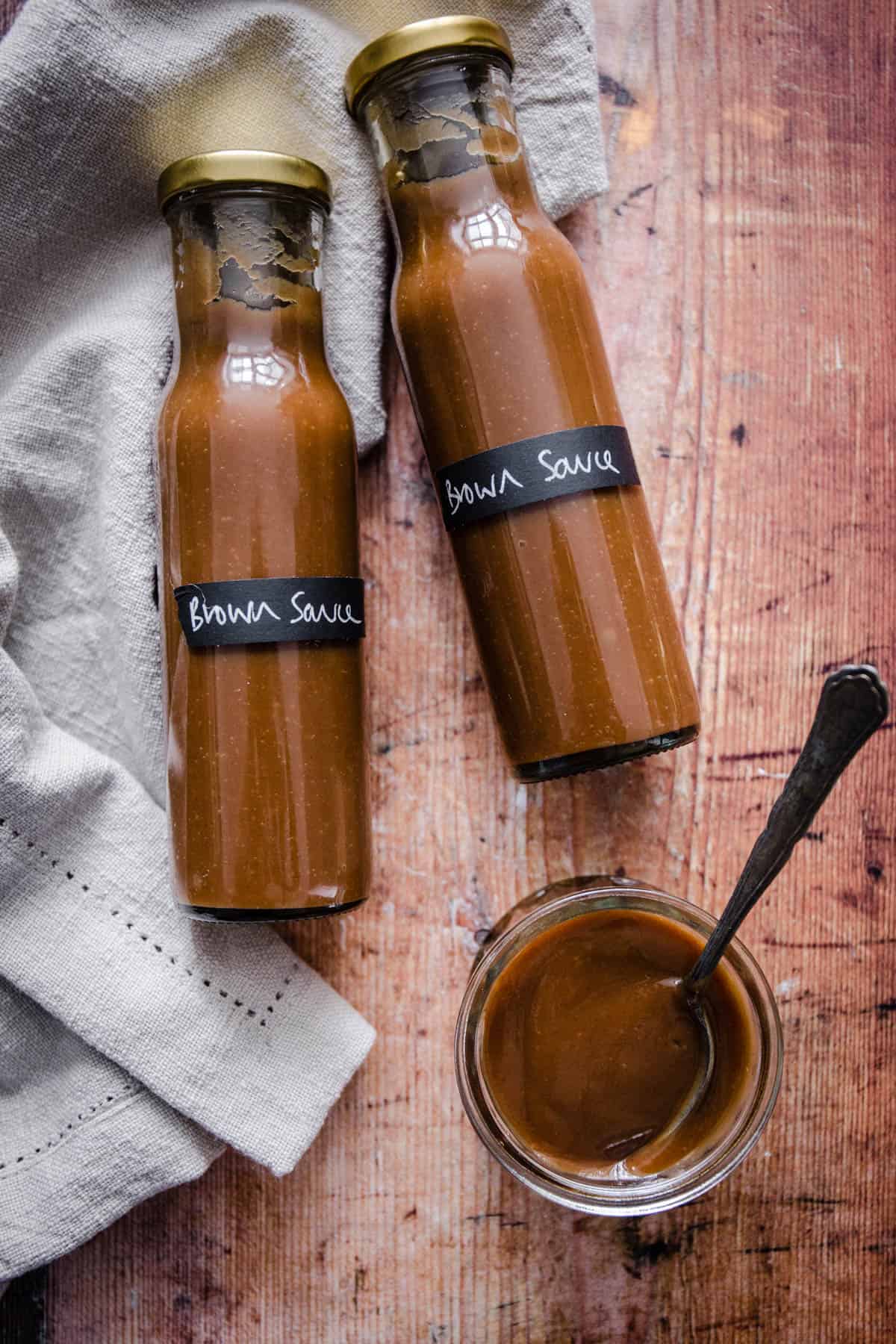 Bottles of brown sauce.