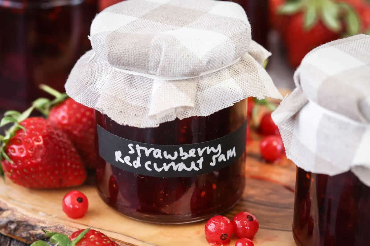 Potted jar of Strawberry Redcurrant Jam.