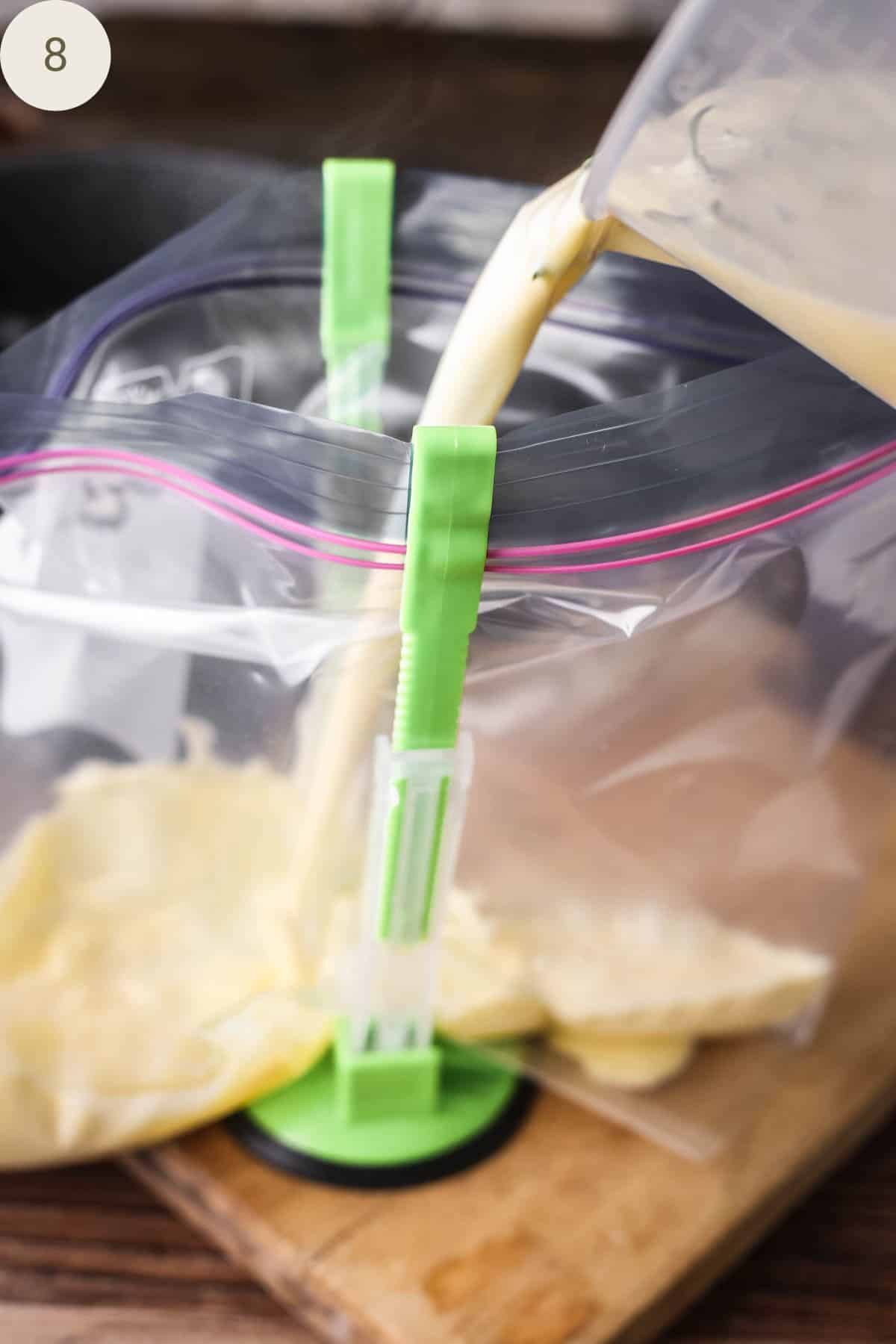 Orange ice cream custard base poured into food storage bag.