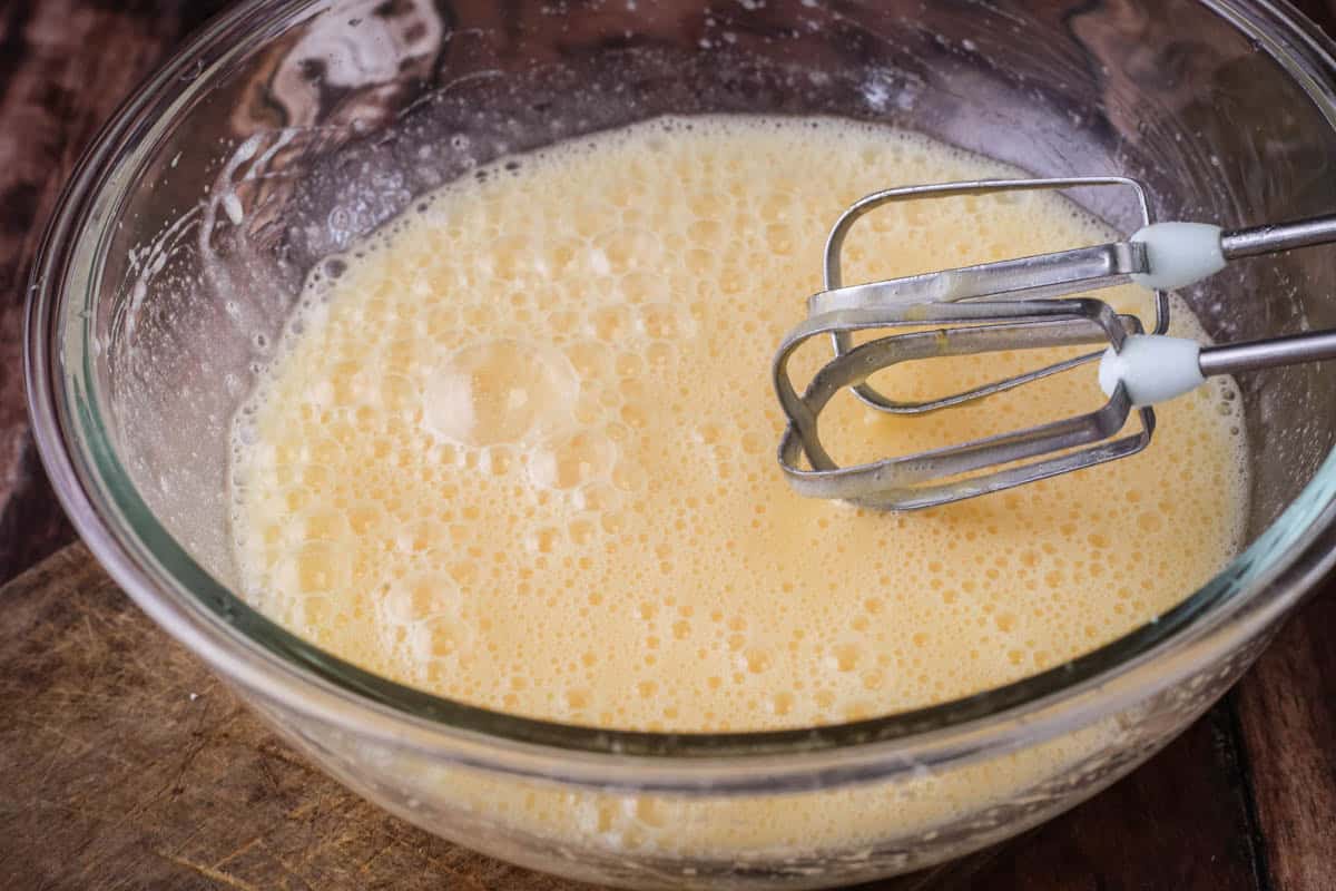 Wet ingredients for Coconut cake mixed together in large mixing bowl.