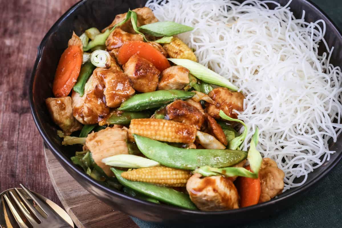 Gluten Free Chicken Stir Fry in a bowl with noodles.