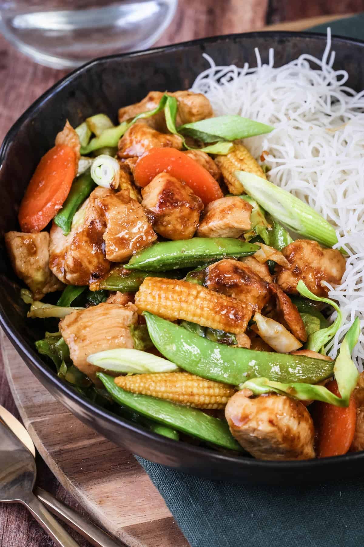 Gluten Free Chicken Stir Fry in a bowl with noodles.