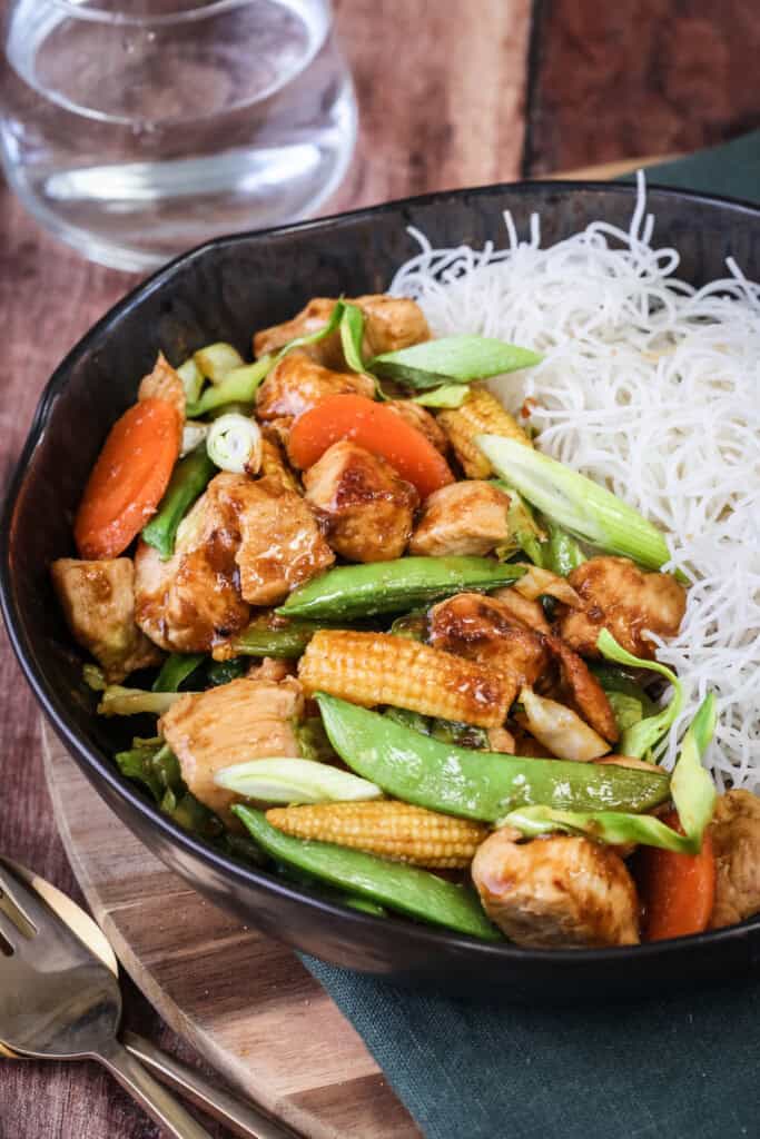 Gluten Free Chicken Stir Fry in a bowl with noodles.