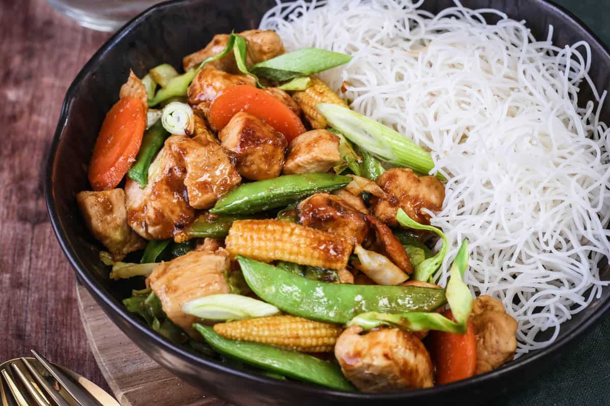 Gluten Free Chicken Stir Fry in a bowl with noodles.