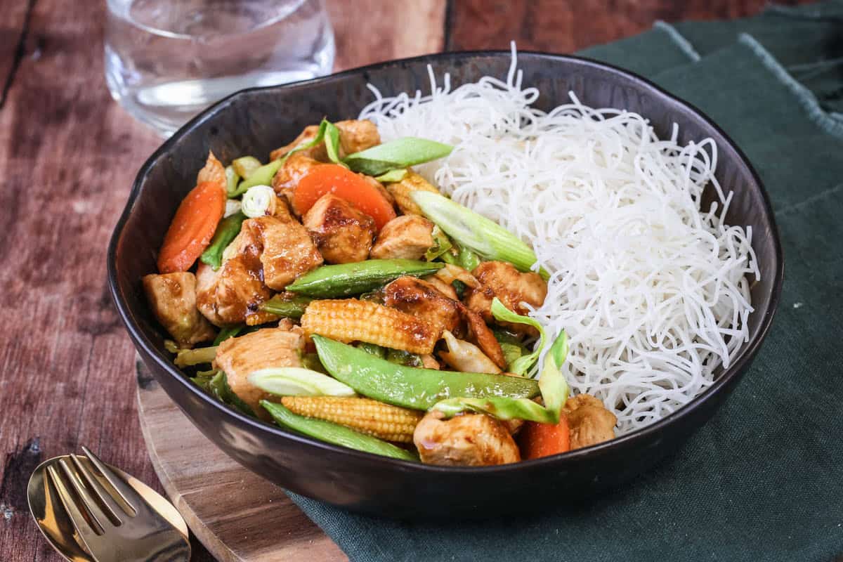Gluten Free Chicken Stir Fry in a bowl with noodles.