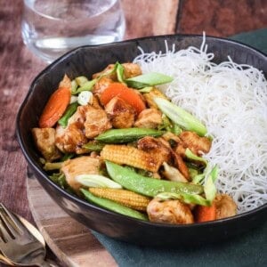 Gluten Free Chicken Stir Fry in a bowl with noodles.