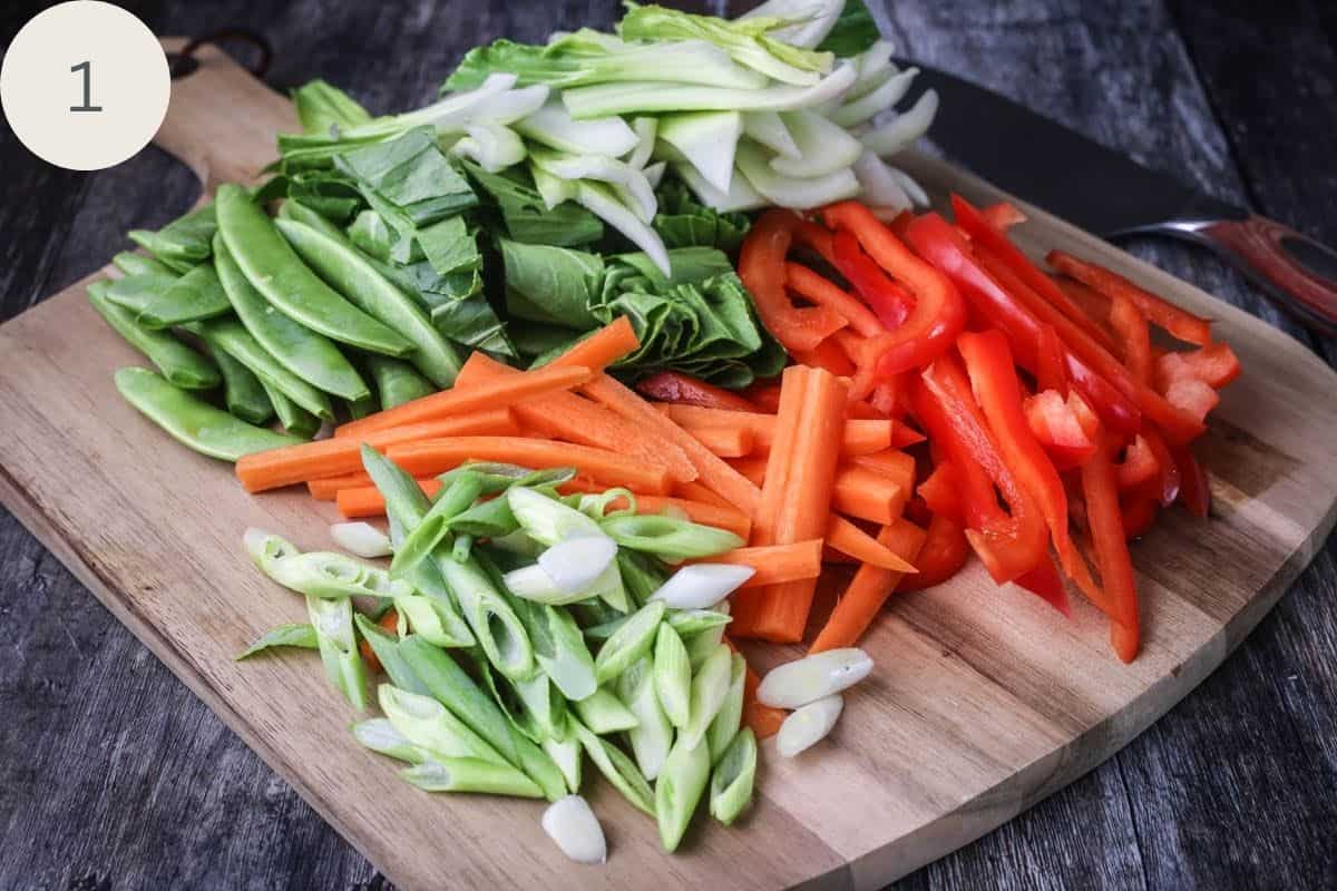 Stir Fry vegetables chopped and on a chopping board.