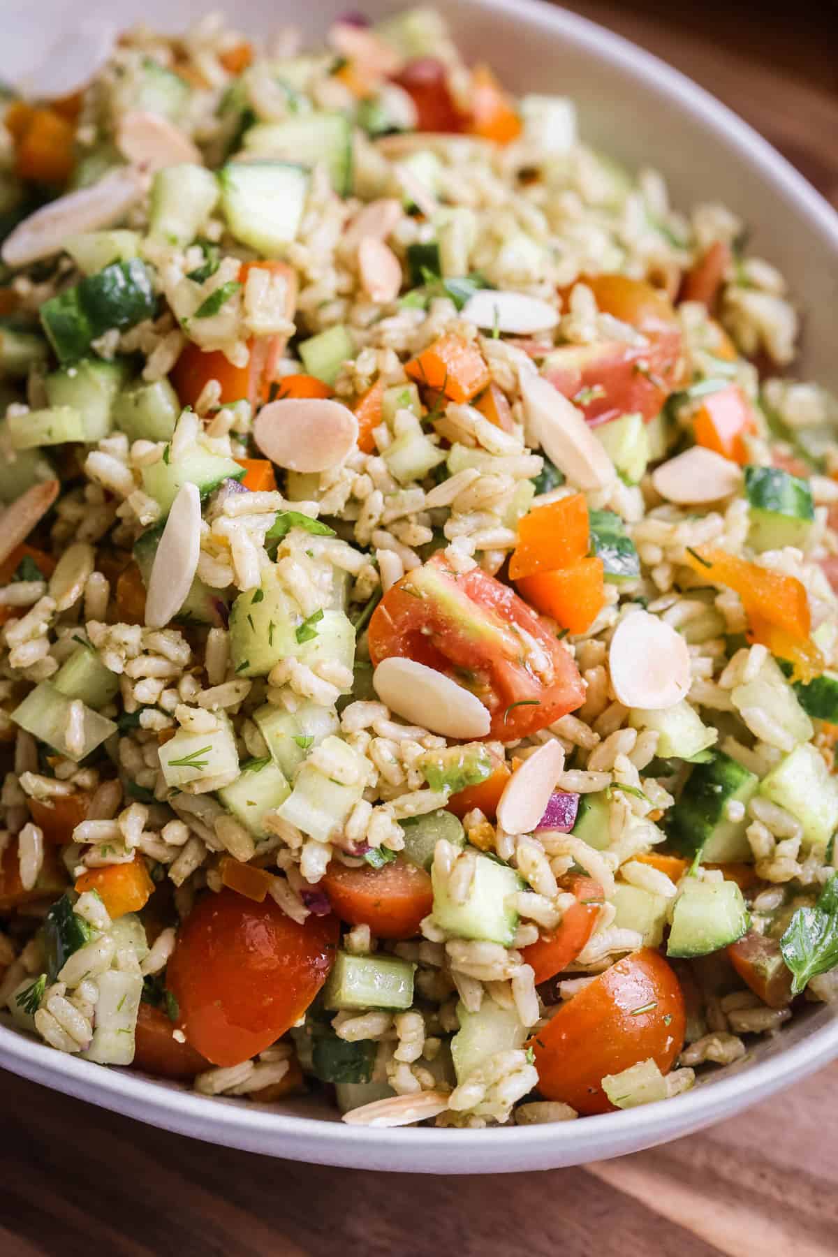 Bowl of Brown Rice Salad with Pesto Dressing.