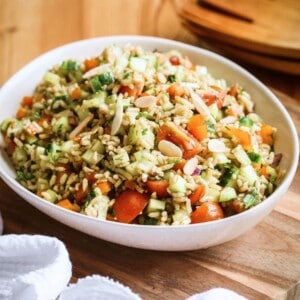 Bowl of Brown Rice Salad with Pesto Dressing.