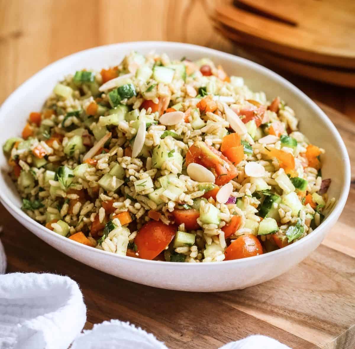 Bowl of Brown Rice Salad with Pesto Dressing.