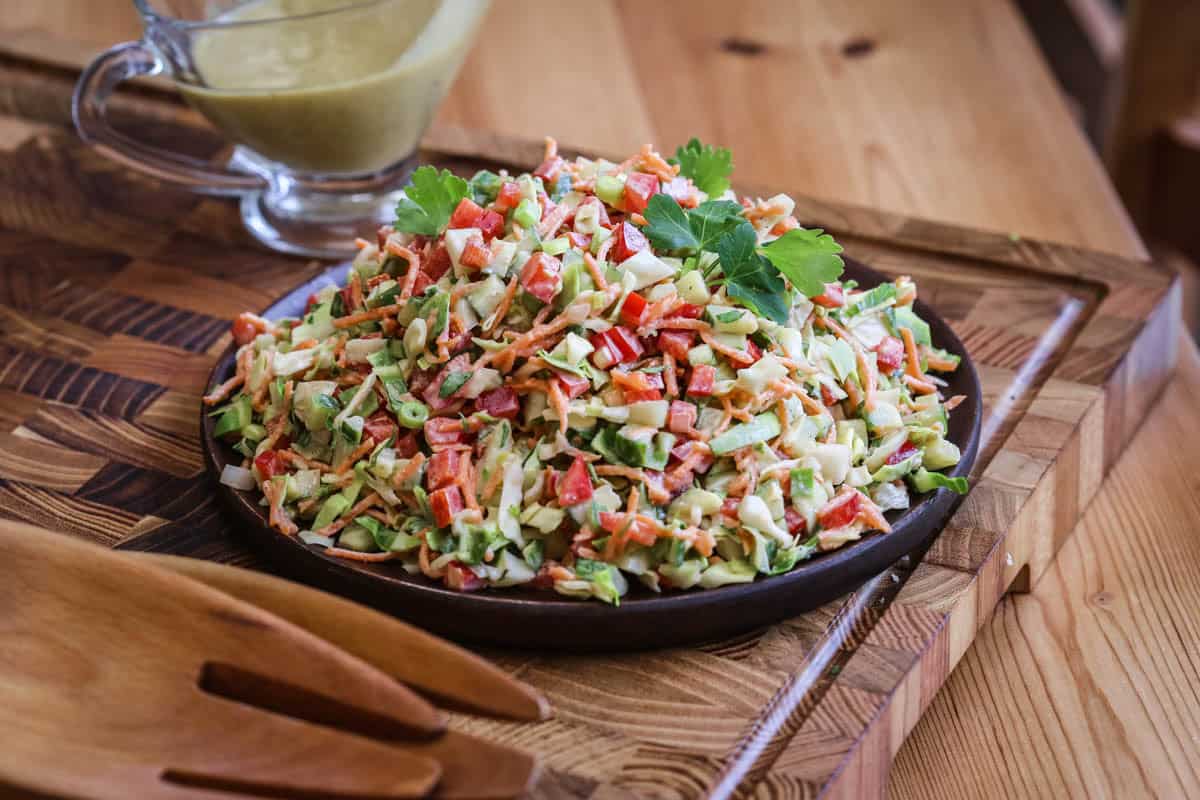 A plate of Crunchy Chopped Salad dressed with Creamy Cashew Dressing.