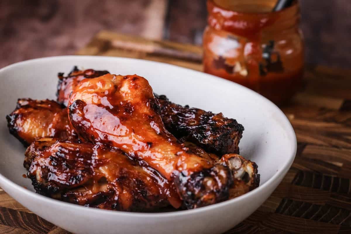 Chicken drumsticks cooked and brushed with BBQ Sauce.
