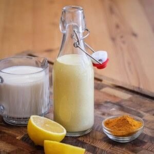 Tahini dressing in a clip top bottle.