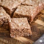 Gluten Free Flapjack on a wooden board showing perfect none crumbly texture.