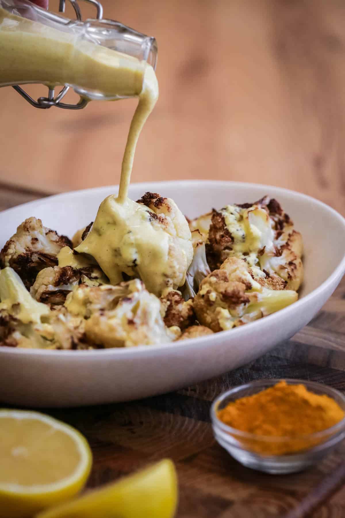 Tahini Dressing poured over roasted cauliflower.