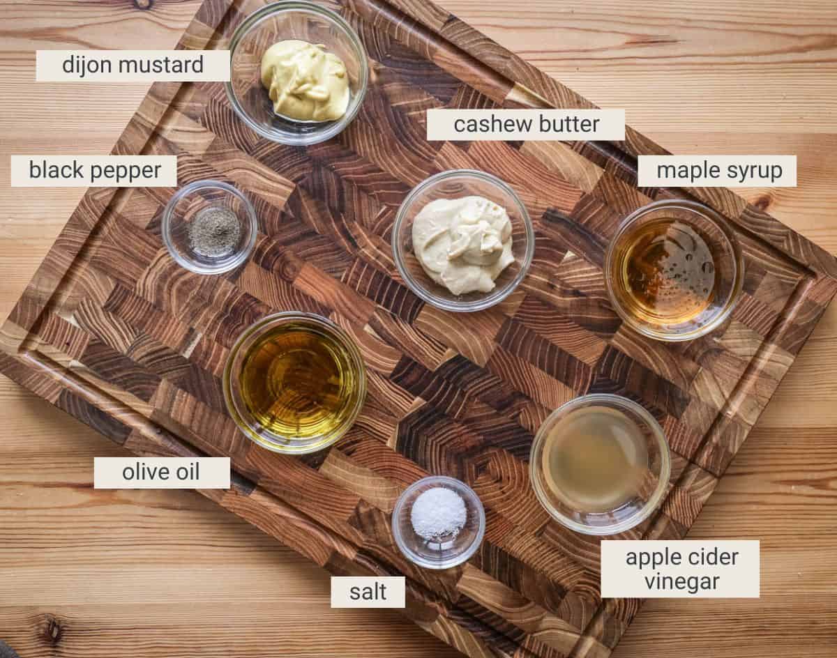 cashew salad dressing ingredients on a board.