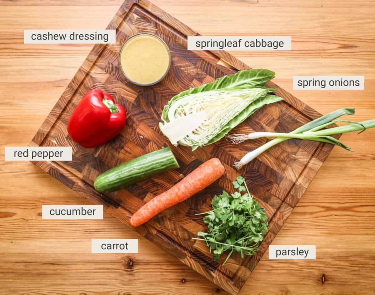Chopped salad ingredients on a board.